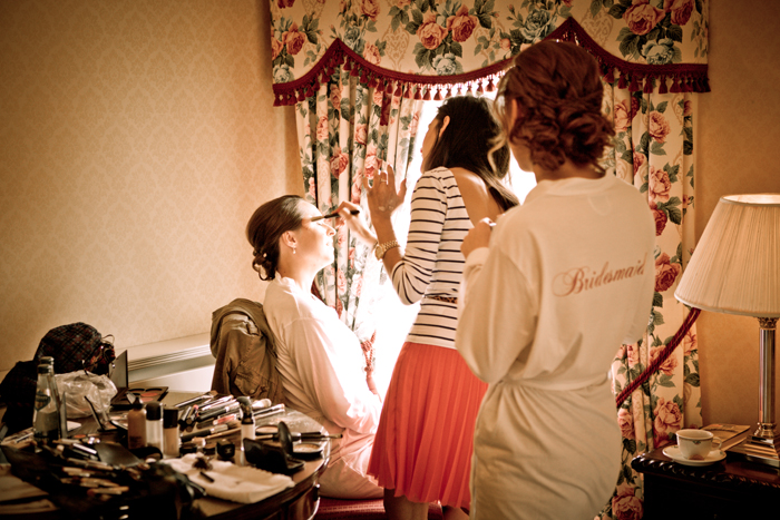 bride getting makeup done